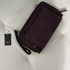 Brown faux leather clutch with detachable strap. NWT